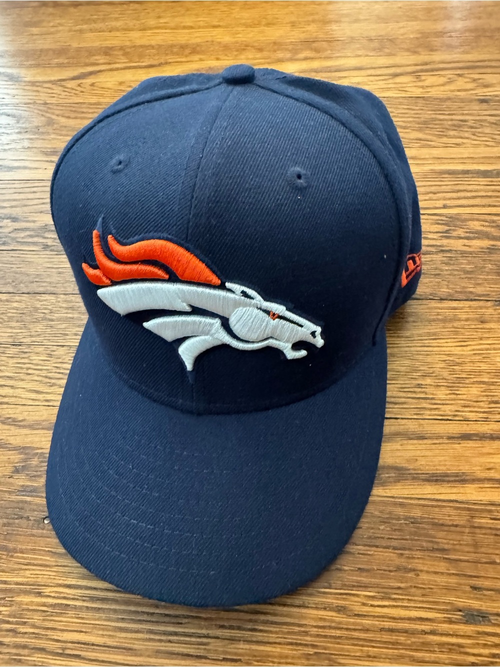 Denver Broncos Navy Snapback Hat with  embroidered HAWAIIAN ISLANDS on the side.